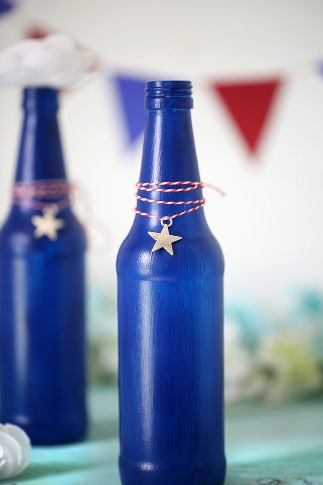 Make your own Red, White & Blue Glass Bottles with this DIY project.