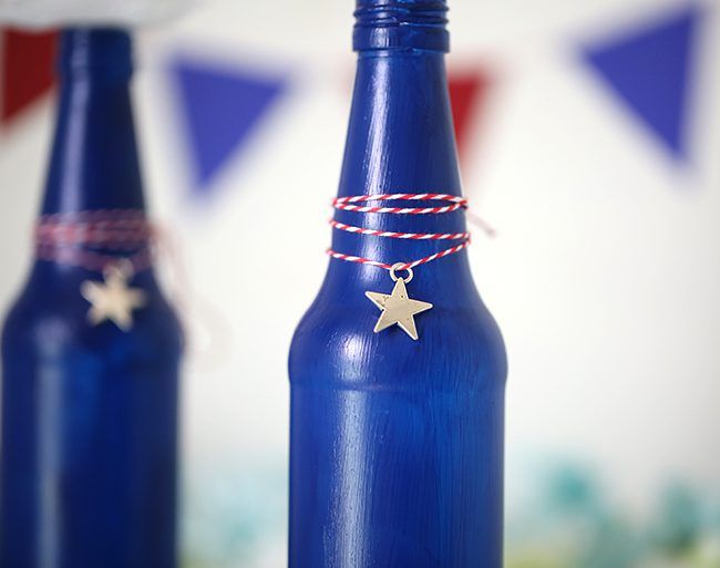 Make your own Red, White & Blue Glass Bottles with this DIY project.