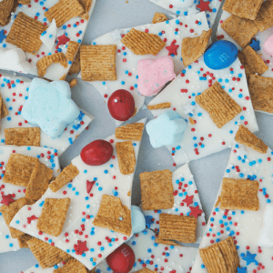 Packed with the classic flavors of s'mores but all dressed up for the 4th of July, this Red, White & Blue S'mores Bark is SO festive and easy to make!