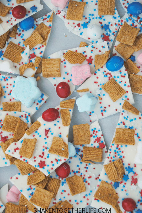 Packed with the classic of s'mores but all dressed up for the 4th of July, this Red, White & Blue S'mores Bark is SO festive and easy to make!