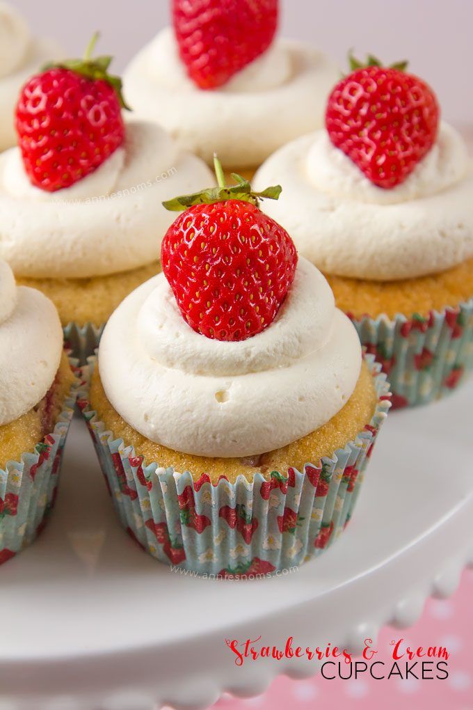 Soft cupcakes filled with chunks of fresh strawberries and topped with sweetened whipped cream and a whole strawberry make these Strawberries and Cream Cupcakes the perfect Summer treat!