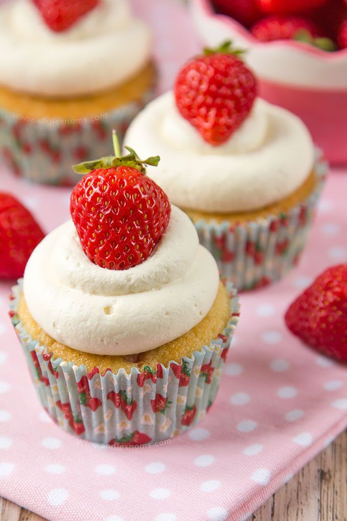 Soft cupcakes filled with chunks of fresh strawberries and topped with sweetened whipped cream and a whole strawberry make these Strawberries and Cream Cupcakes the perfect Summer treat!