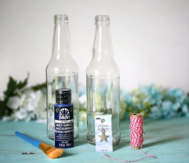 Make your own Red, White & Blue Glass Bottles with this DIY project.