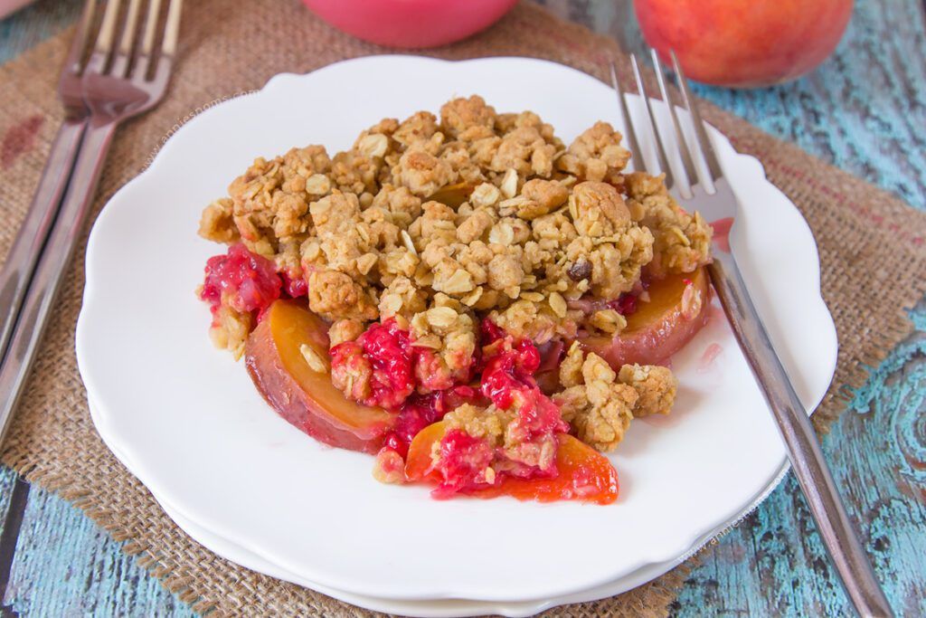 An easy, comforting dessert, using late Summer fruit. Make-ahead and perfect hot or cold, this crunchy, fruit filled Raspberry Peach Crumble will have everyone wanting second helpings!