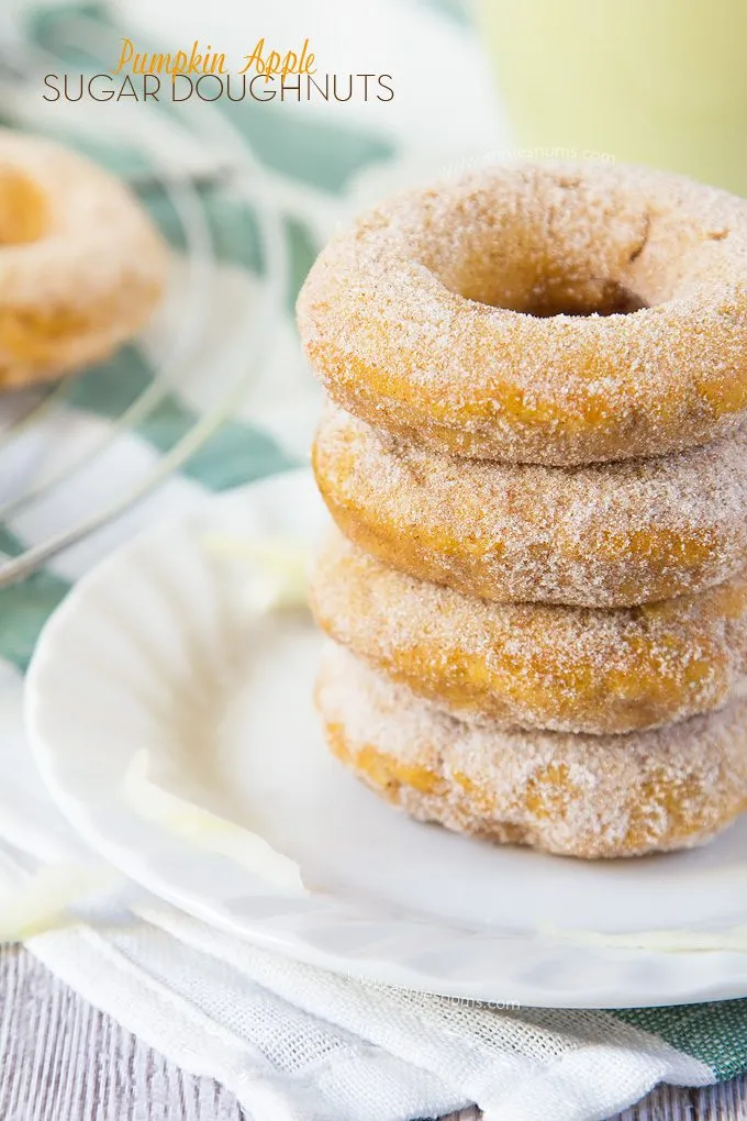 These Pumpkin Apple Sugar Doughnuts are baked, not fried and jam packed with pumpkin and freshly grated apple. Rolled in cinnamon sugar to finish them off, these are simply sublime!