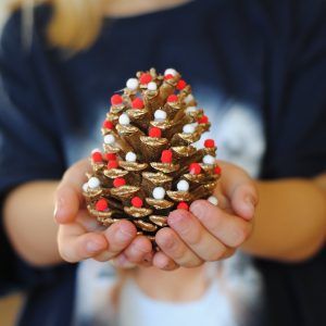 These Pom Pom Pinecone Trees are the perfect Christmas Decoration that the whole family can help make!