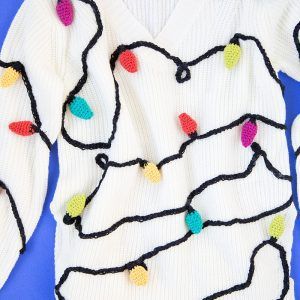 Christmas Lights Sweater: If you are attending an ugly Christmas sweater party this year, we have got you covered! Here are 25 Ugly Christmas Sweater Ideas for you to use as inspiration.