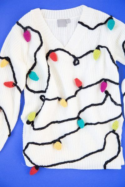 Christmas Lights Sweater: If you are attending an ugly Christmas sweater party this year, we have got you covered! Here are 25 Ugly Christmas Sweater Ideas for you to use as inspiration.