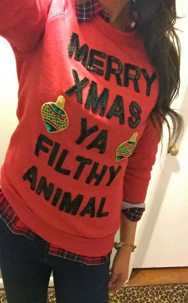 Ya Filthy Animal Sweater: If you are attending an ugly Christmas sweater party this year, we have got you covered! Here are 25 Ugly Christmas Sweater Ideas for you to use as inspiration.