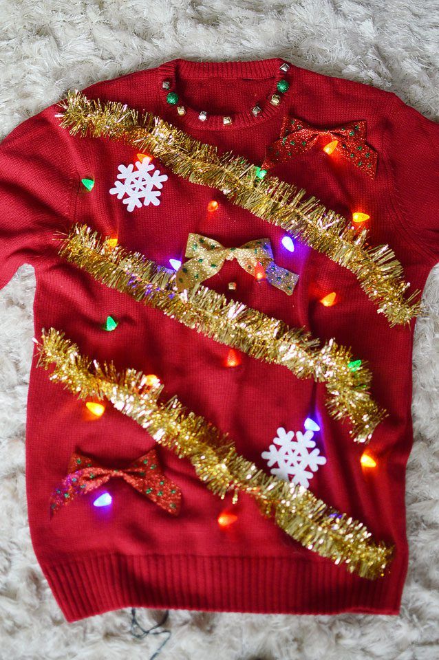 Lights and Tinsel Sweater: If you are attending an ugly Christmas sweater party this year, we have got you covered! Here are 25 Ugly Christmas Sweater Ideas for you to use as inspiration.