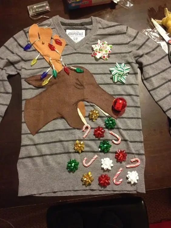 Barfing Reindeer Sweater: If you are attending an ugly Christmas sweater party this year, we have got you covered! Here are 25 Ugly Christmas Sweater Ideas for you to use as inspiration.