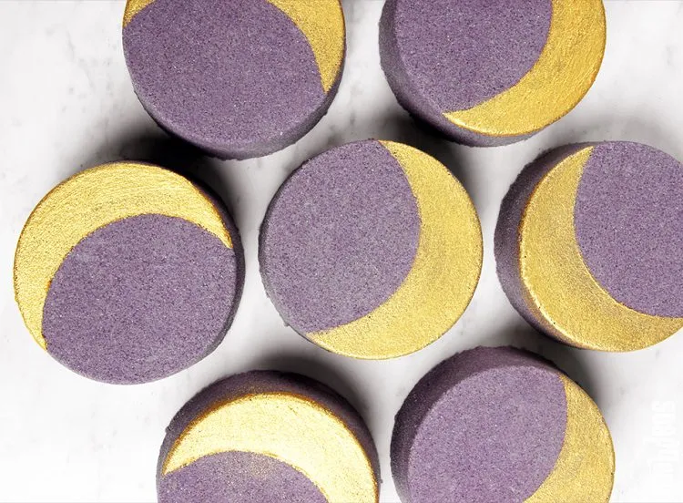 DIY Space-Inspired Projects: Creative Crescent Moon Bath Bombs with gold and dark lavender colors