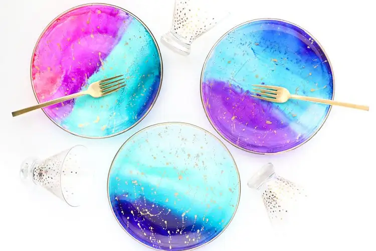 Gorgeous Galaxy Plates with forks and dotted glasses