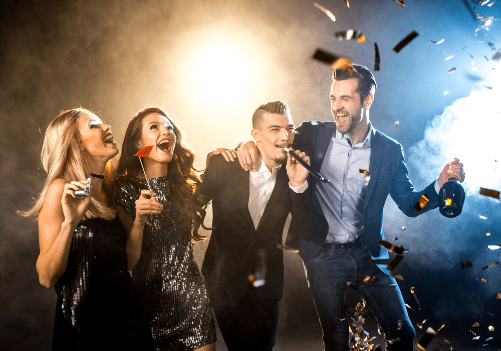 two men and two women partying 