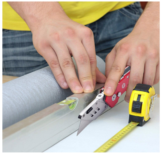 man cutting the screw cap with utility knife