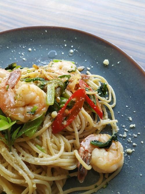 shrimp pasta served on gray plate