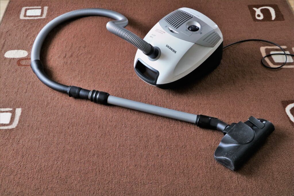 Handheld vacuum in the carpet