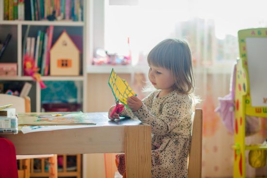 Kid Cutting Paper