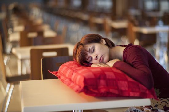 A woman sleeping on a pillow in  pillow case, which is one of our Easy sewing projects for beginners.