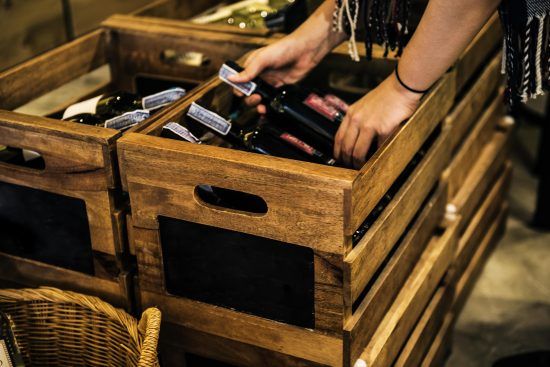 People Hands Getting Bottle of Red Wine