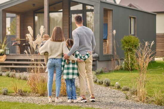 happy family admiring their home